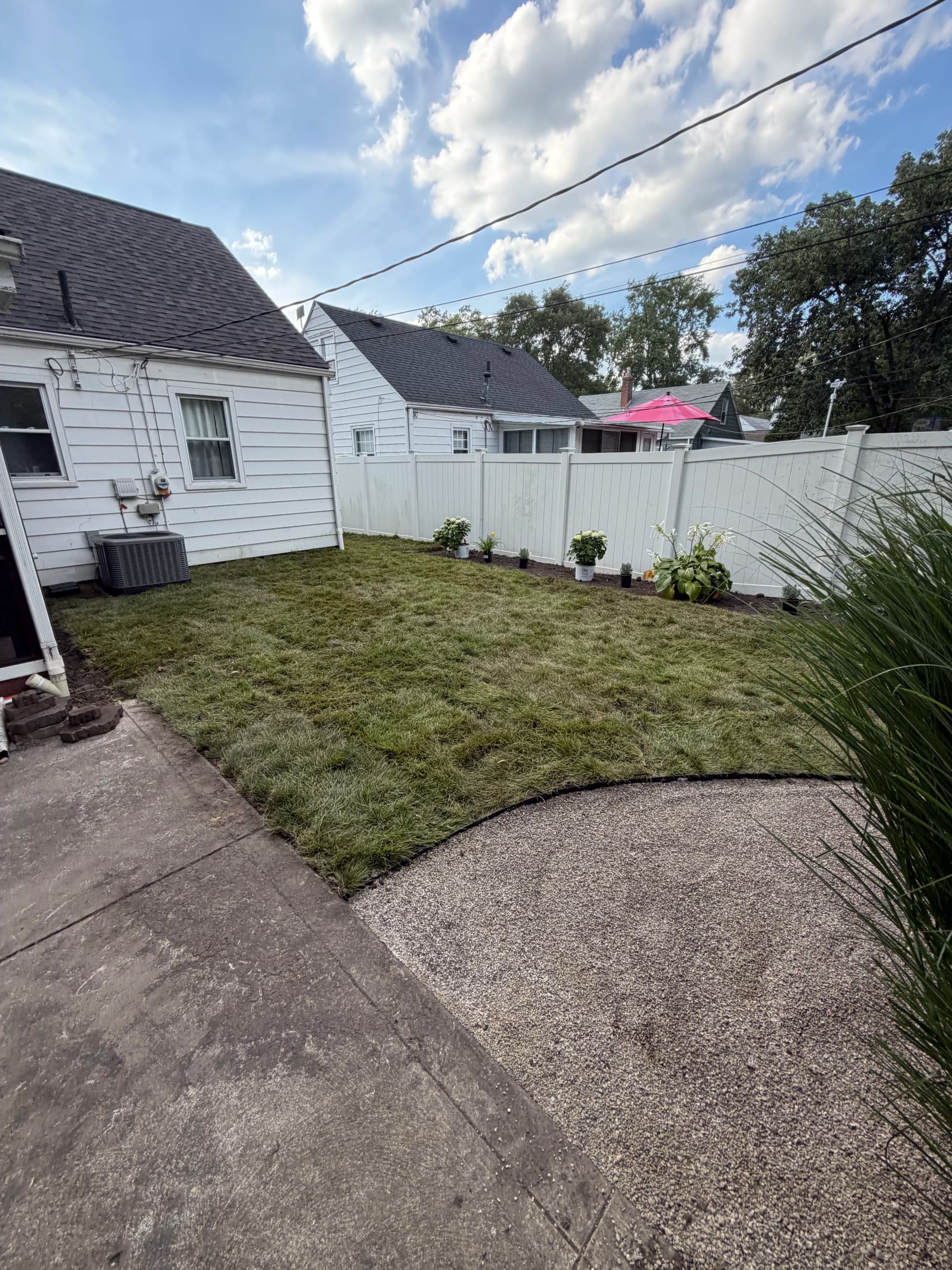 Shrub Removal, Sod Install and Fresh Plantings Give This Backyard a New Life image