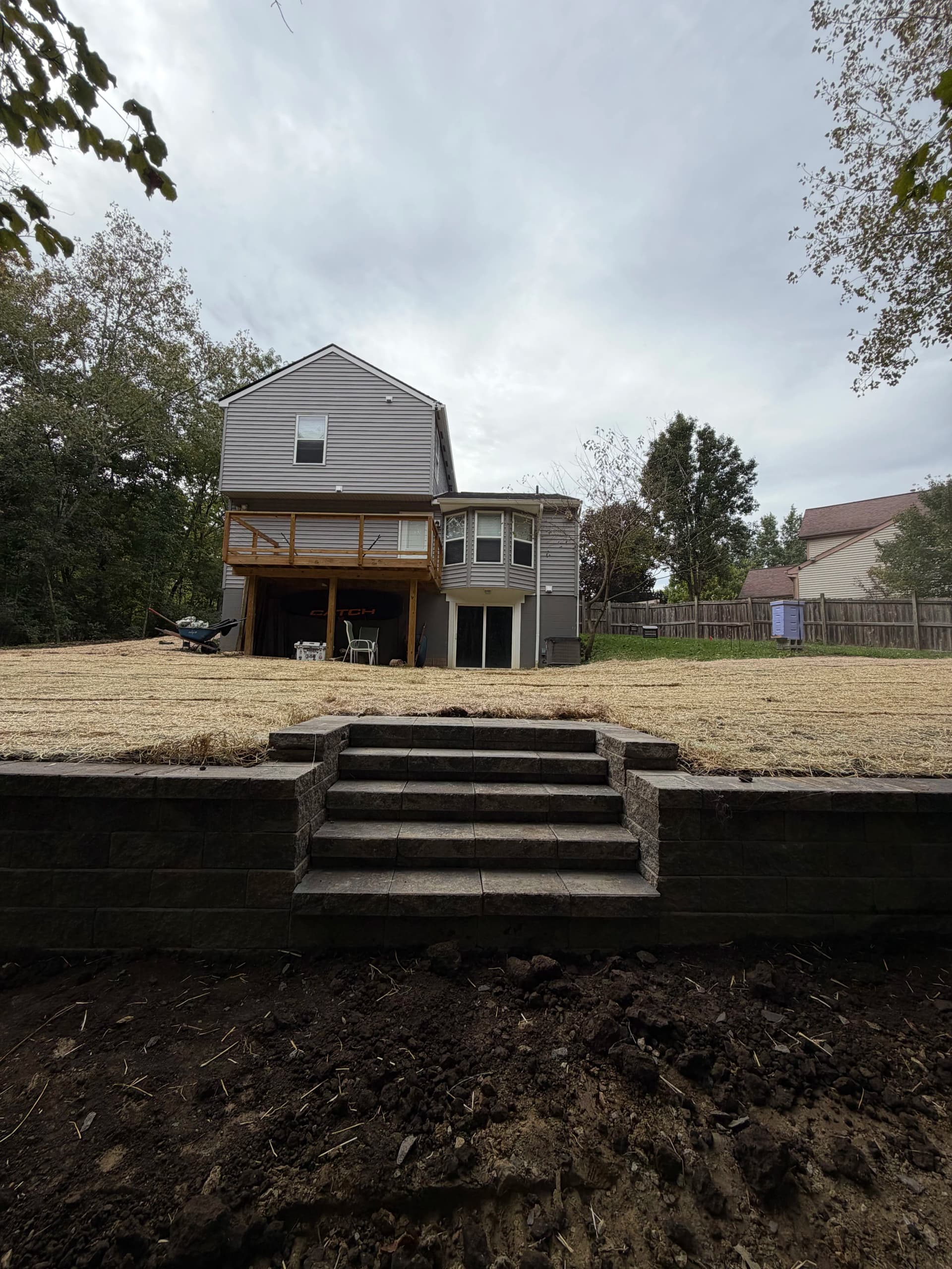 140-Foot Versa-Lok Retaining Wall with Yard Regrading