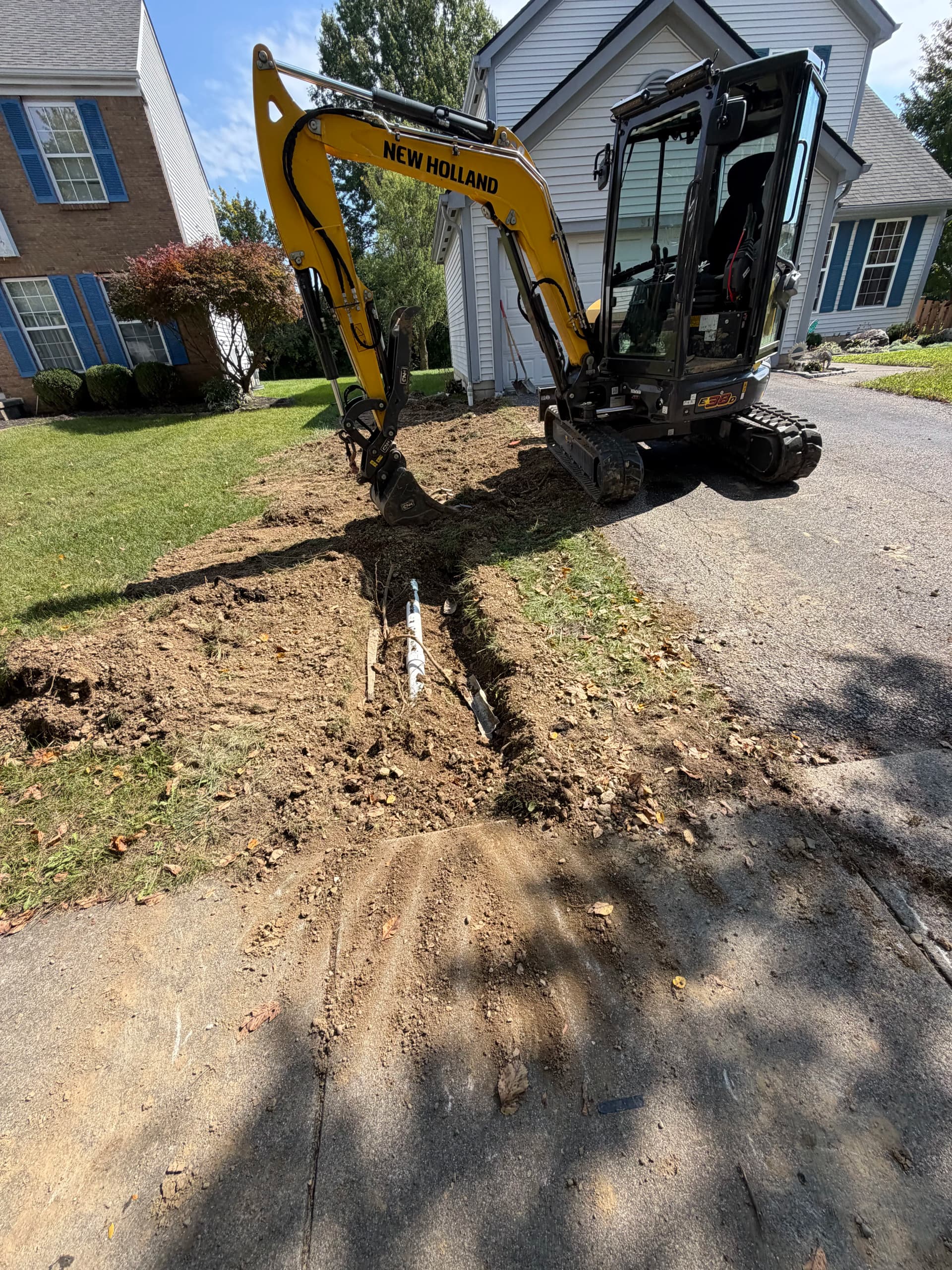 Buried Downspout Replacement and Full Lawn Regrade Fix